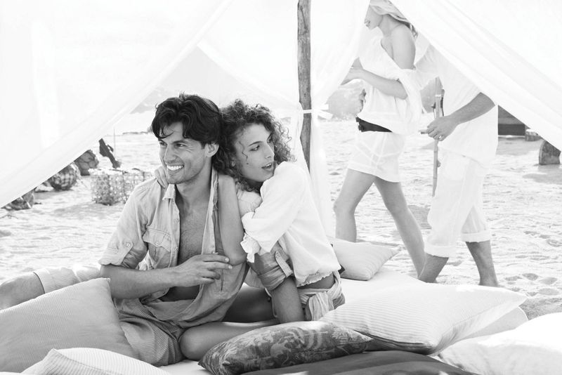 Couple of the beach smiling 