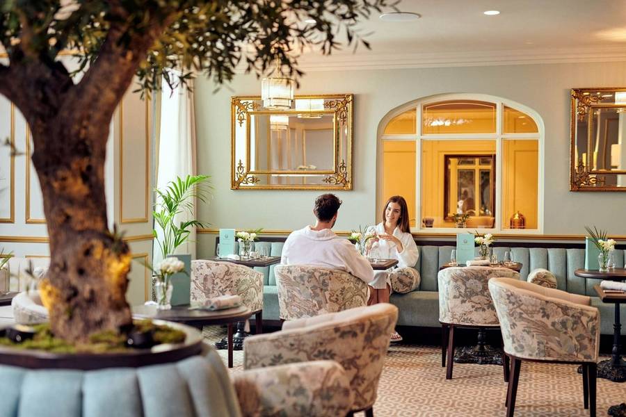 Couple eating breakfast at Grantley Hall on a wellness honeymoon